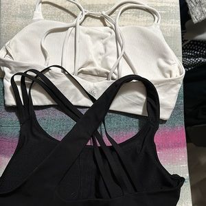 Pair of Athleta sports bras size M